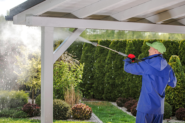 Power washing Toms River professional working on pergola/gazebo.
